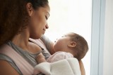 Black mother holding baby