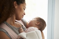 Black mother holding baby